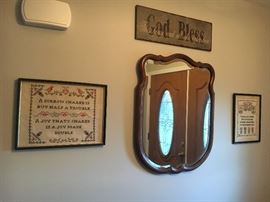 Assorted home decor--framed embroidery, mirror, plaque.
