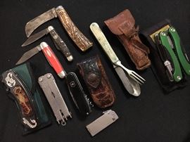 Assorted vintage pocket knives and multi tools.