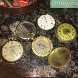 Assorted pocket watches, compass