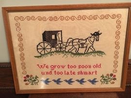 Framed embroidery motto.