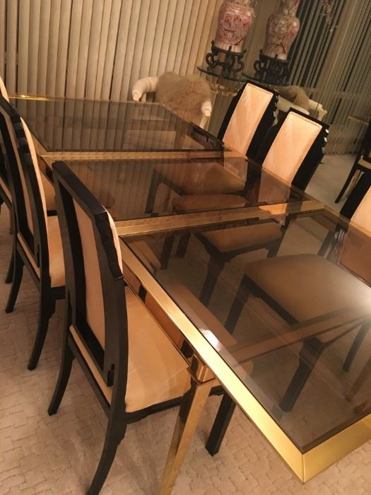 Brass & smoked glass dining table shown with the extension leaf in, Made in Italy and six Deco inspired black lacquered chairs sold separately 