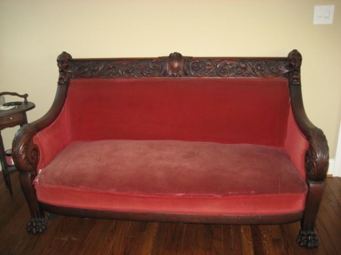 Antique late 1800's Parlor settee has a matching chair, carved wood man's/devil head leads to a scrolled arm into hairy feet.  Both need to be reupholstered 