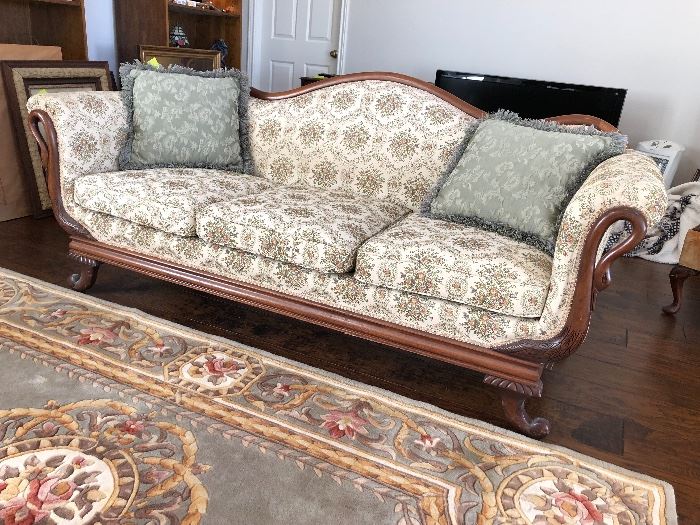 Early 1900's sofa with Swan curved neck wood details and  with more recent upholstery. 
