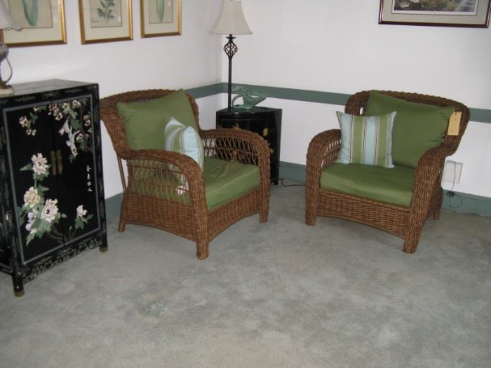                 Comfy modern wicker chairs and decorative 
                                    Asian style cupboards.