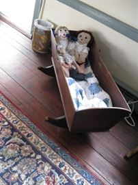    Antique cradle and much loved Raggedy Ann & Andy