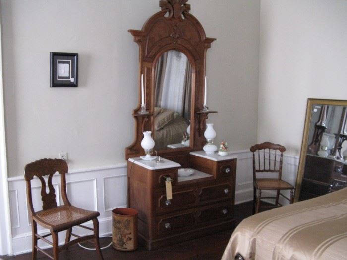       Late 19c Renaissance Revival walnut dresser and 
                                       late 19c chairs