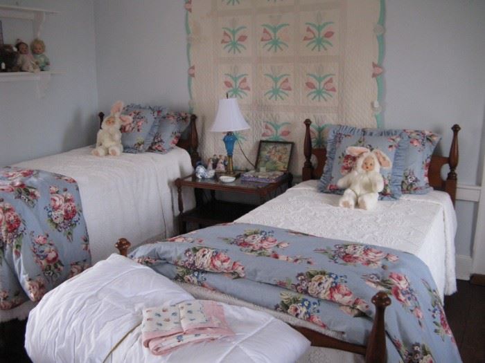    Pair Colonial Revival style twin beds with custom made 
                                              comforters 