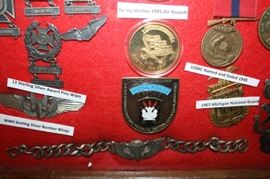 There is a Large selection of Military service and achievement Medals, Pins, Badges etc.