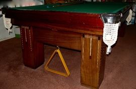1924 Monarch Cushion pool table and accessories by The Brunswick-Balke-Collender Co. Table is 56"Wx102"Lx32"H; inside measurements: 48"x93". Note pearl inlay. Special side drawer for cue sticks. Vinyl cover. Contact 314-518-1818 if interested before the sale.