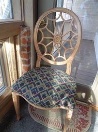 closeup of chair that goes w/round tile top dining table