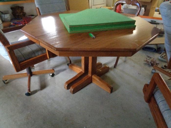 dining table w/4 chairs on roller, pads & leaf