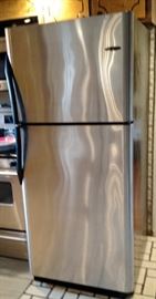 Frigidaire Refrigerator with ice maker Chrome and Black with black handles. Very nice works like a charm.