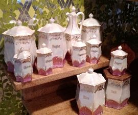 Made in Germany Mother of Pearl and Pink 11 Piece Canister Set. Includes Oatmeal, Sugar, Barley, Rice, Salt, Oil Decanter, Allspice, Cinnamon, Ginger, Pepper, Cloves. In great condition.