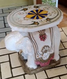 Inside or Outside is where this Ceramic Table with Elephant Base could fit.