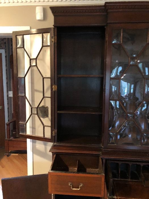 1820-1880 Breakfront Library Cabinet/Hutch featuring the side storage area and detail sectional pull out drawer on each side.  The photo showcases the beautiful “Bubble Glass”.    Solid Wood