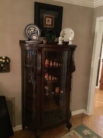 Antique three sided round glass front Curio Cabinet