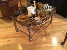Metal framed coffee table with glass top
