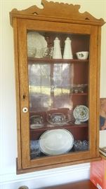 Antique Oak hanging wall cabinet with wavy glass