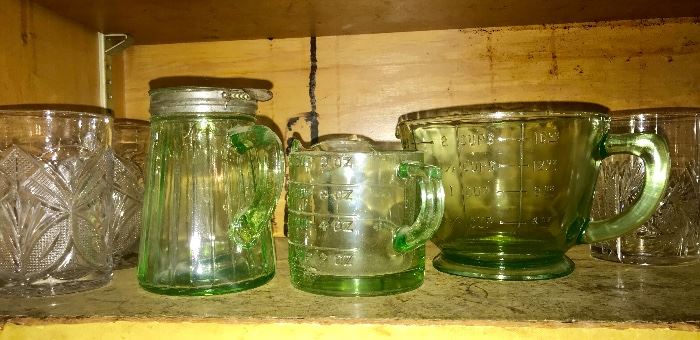 Large and small Depression green glass Measuring cups and Syrup jar.   So hard to find in excellent condition