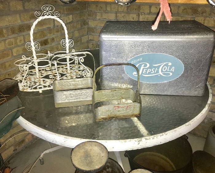 Vintage metal Pepsi cooler, two metal Pepsi carrying cases and wrought iron glass holder and metal patio table with glass top