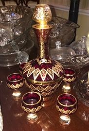 Red and gold decanter w/6 glasses 