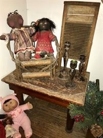 Black memorabilia ; small table; washboard; candle sticks; small chair