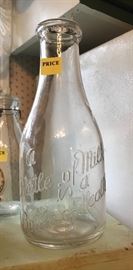 Vintage milk bottle - "A Little of Milk is a Bottle of Health"