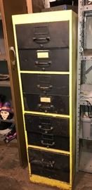 Tall vintage yellow and black file cabinet 