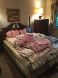 Full-size bed, linens, sheets, blankets,  pillows. 