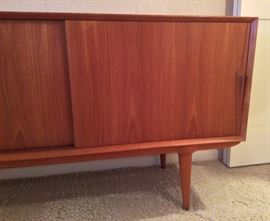More sideboard - behind 2 sliding doors is one long storage bay with an adjustable shelf.