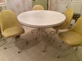 Round kitchen table with metal base + 4 matching vinyl chairs by Brody