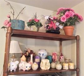 Candles, piggy banks, faux flower arrangements