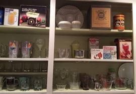 More kitchen items: utensils & gadgets, Pyrex measuring cups, glassware, Nabisco tins