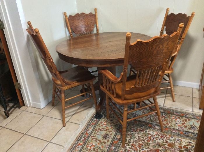 Antique 48" diameter Oak Table and Chairs. 