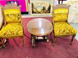 Antique Pr Eastlake Chairs with porcelain wheels. Solid Oak drop leaf oval table