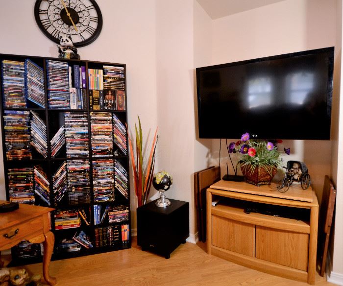 DVD's galore and TVs for sale. More clocks.