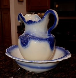 Blue and white ceramic wash bowl and pitcher.
