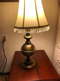 Brass lamp with beaded shade