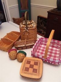 Longaberger baskets.  Many more not pictured.  Most are classic stain with some that are warm brown.  Traditional styles and seasonal items.  Some have protectors, liners and dividers.  Come check out the whole collection!