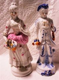 Pair porcelain colonial statues