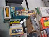 a table FULL of assorted Train pieces and parts, engines, cars, caboose, track, buildings, villages, and So much more.... most of these pieces are in the original boxes
