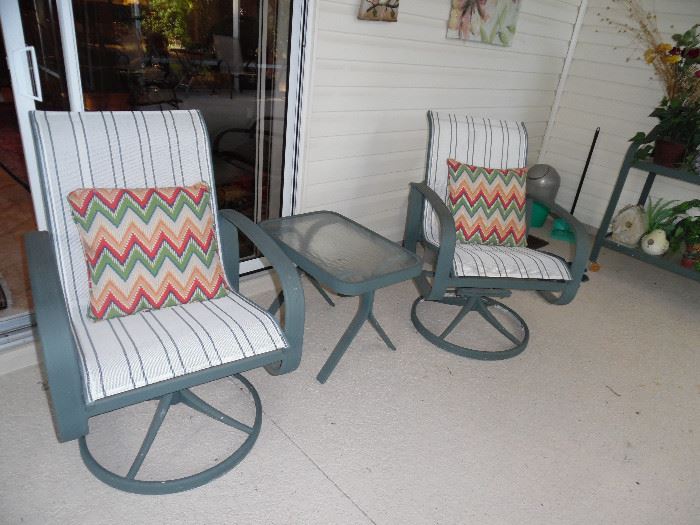 Pair of Rocker/Swivel Chairs with small table