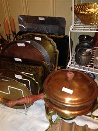 Plethora of brass and copper trays; copper and brass chafing dish
