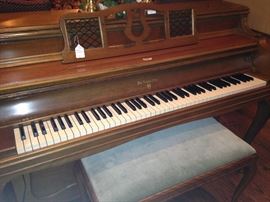 This William Knabe & Company piano (hand-made at Knabe’s original factory in Baltimore) has folding music rack and 4 carved legs. The matching piano bench provides sheet music storage. 