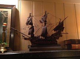 This very old sail ship is handsome decor for this massive fireplace.