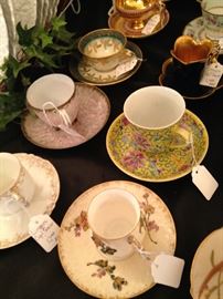 Some of the over 30 demitasse cups and saucers