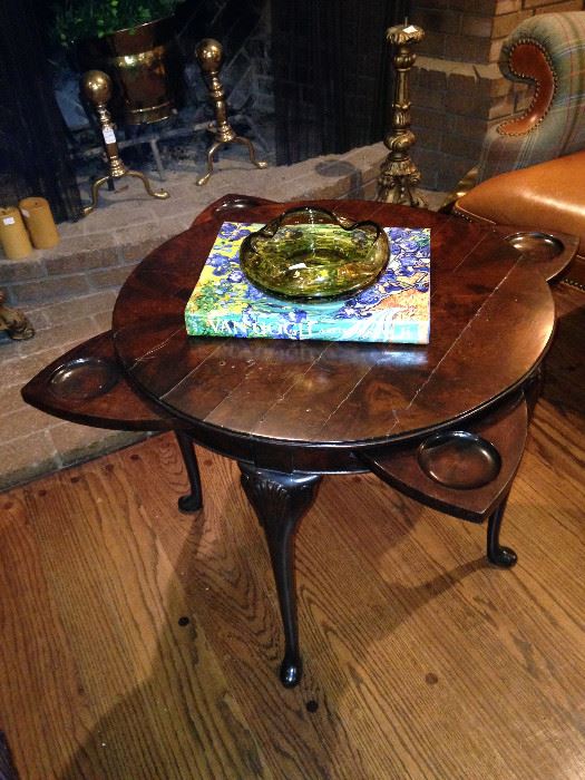 Rotate the top of this impressive antique table, and the "coasters" disappear. 