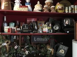All collection of cookie jars.  Vintage tins, typewriter, and other collectibles.