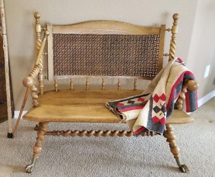 Antique settee and vintage blankets for sale.
