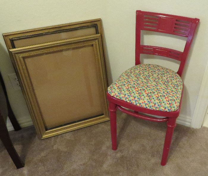 Red chair, picture frames
